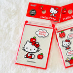Two packaged Hello Kitty apple-themed compact mirrors.