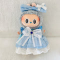 A plush doll wearing a light blue dress with white lace trim and a large white bow at the waist.  