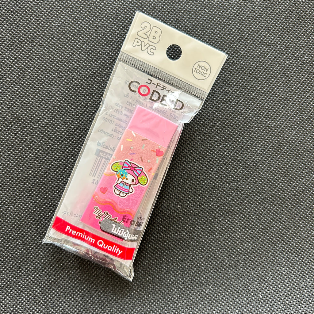 A packaged set of 28 pink PVC code-tape sections featuring a cute character design, sealed in a clear plastic bag with a white header card, placed on a dark gray textured surface.