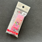 A packaged set of 28 pink PVC code-tape sections featuring a cute character design, sealed in a clear plastic bag with a white header card, placed on a dark gray textured surface.