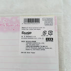 A close-up of a Sanrio Little Twin Stars letter set paper card, showing the back side with a barcode, product code CH-26510, Japanese text, and a pink border.