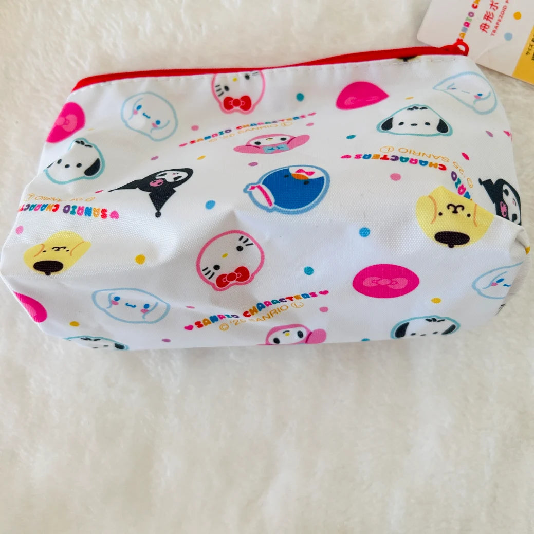 A white zippered pouch decorated with colorful Sanrio character prints, including Hello Kitty, Pompompurin, and Sanrio characters, resting on a white textured fabric background.