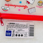 A close-up of a white glittery Sanrio Hello Kitty zippered pouch with a bright pink zipper, featuring printed Sanrio and Hello Kitty graphics, alongside a white product tag with Japanese text and a barcode.