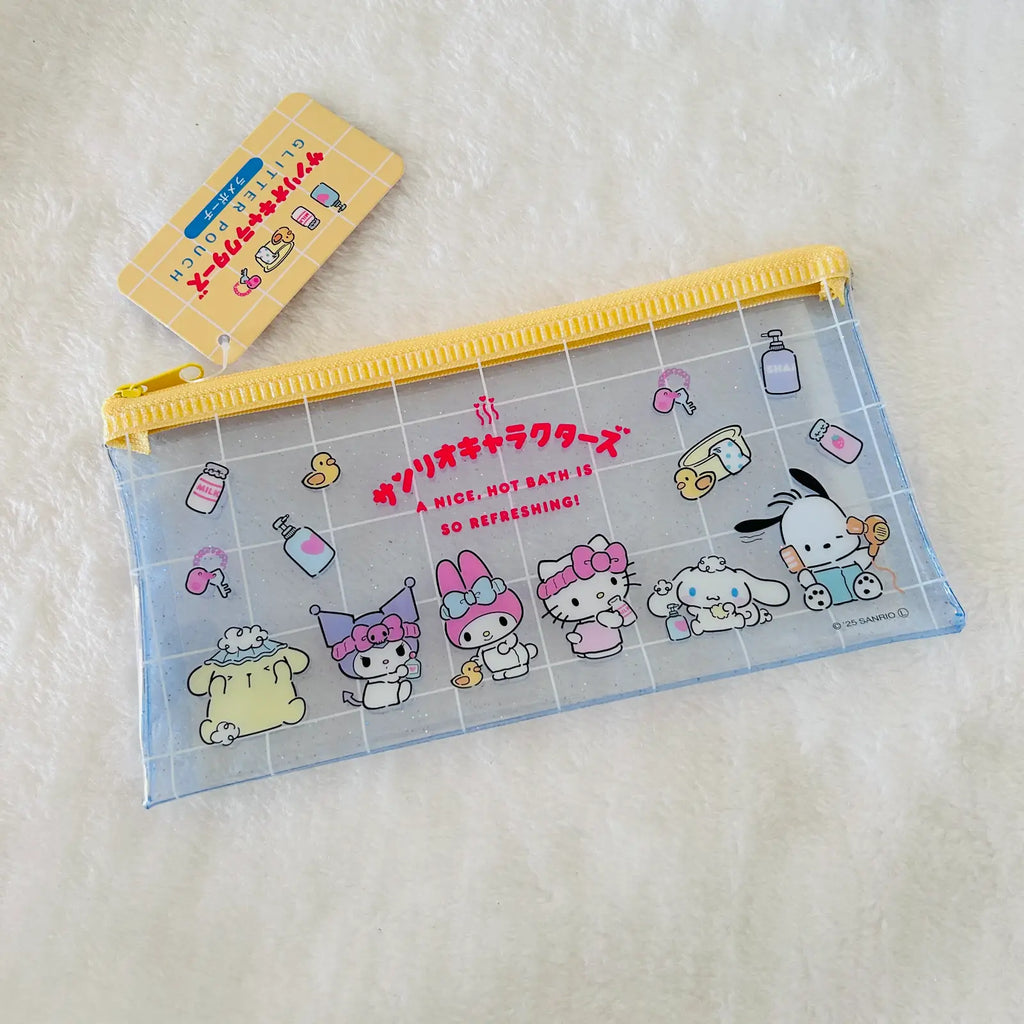 A Sanrio character pencil pouch with a yellow zipper, featuring Cinnamoroll, My Melody, and Sanrio characters on a light blue grid background, shown on a white textured background with its yellow tag.