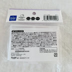 A packaged Sanrio Hello Kitty product in a clear plastic bag with a printed white backing card. The card shows the Sanrio and Hello Kitty logos, a barcode, and multiple lines of Japanese warning and product information.
