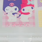 A close-up of a Sanrio character sticker or card featuring Kuromi and My Melody on a pink checkered background, with '© 25 SANRIO' printed below.