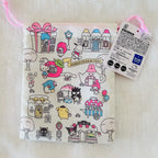 A Sanrio character print drawstring pouch with a white background and pink ribbon, featuring illustrations of Hello Kitty, My Melody, Cinnamoroll, Kuromi, and other Sanrio characters, with a product tag attached.