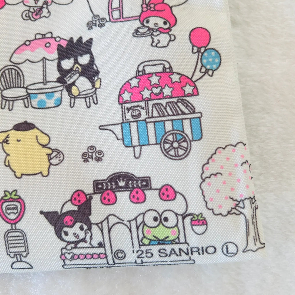 A close-up of a fabric or paper print featuring Sanrio character illustrations, including Kuromi, My Melody, and Pompompurin, in a picnic-themed pattern on a white background.