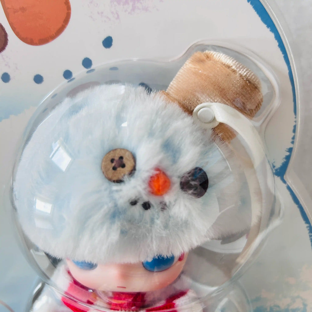 A close-up view of the Dimoo Snowman series plush doll head, shows light blue flurry texture with bucket hat. 