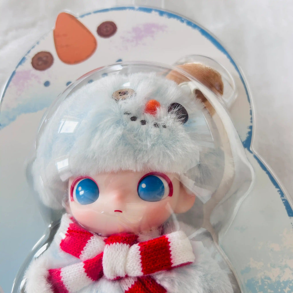 A close-up view of the Dimoo Snowman series plush doll, shows it face with red-and-white striped knit scarf. 