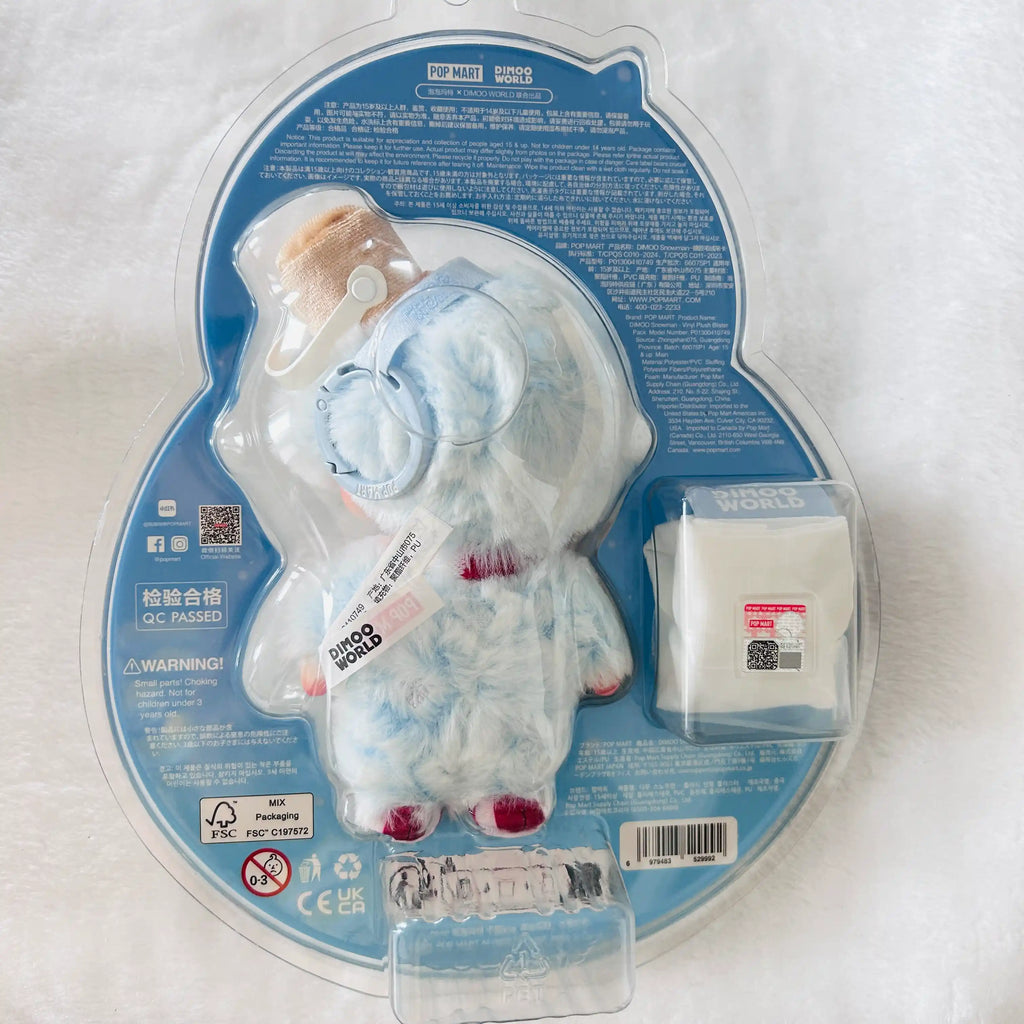 A packaged Dimoo Snowmanplush toy in a clear blister pack on a blue backing card. 