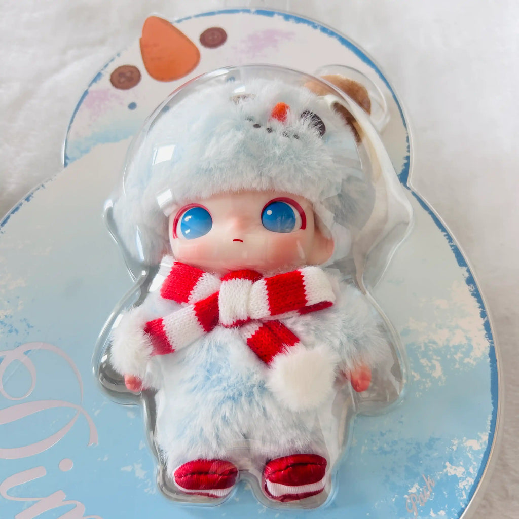 A small Dimoo Snowman plush doll dressed in a fluffy light blue winter outfit with a red-and-white striped scarf and red shoes.