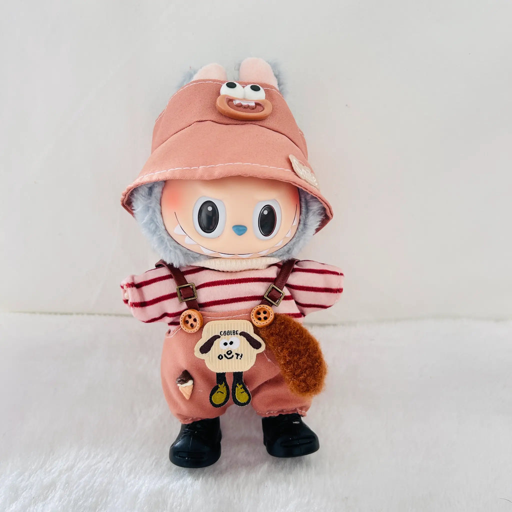 A Labubu plush doll wearing a dusty coral bucket hat, red-and-white striped shirt, dusty coral overalls, and black boots.