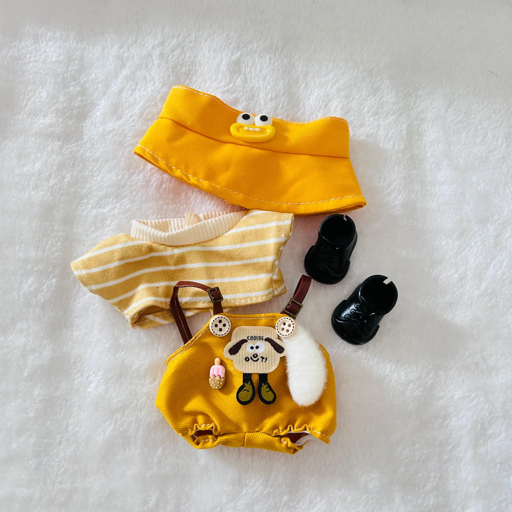 A Labubu plush clothing set including a yellow outfit with a striped shirt, brown suspenders, black boots, and a yellow bucket hat.
