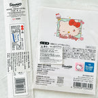 A sealed Sanrio Hello Kitty product package,  with Japanese text, a cartoon Hello Kitty illustration, barcode, QR code, and a blue Sanrio logo block.