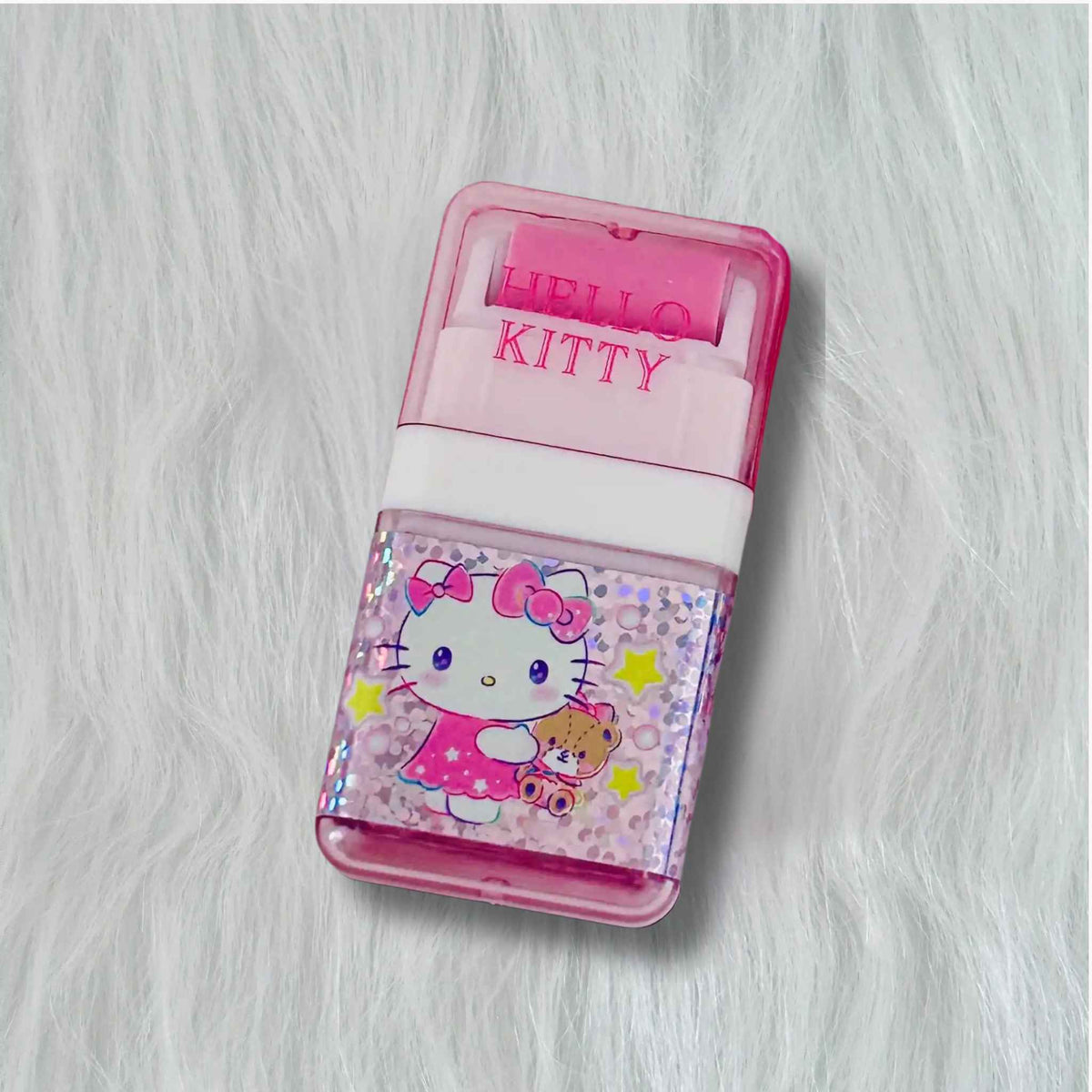 Front view of a pink Sanrio Hello Kitty Erasers with roller shavings collector, featuring a Hello Kitty illustration.
