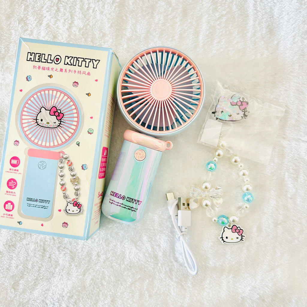 Hello Kitty mini portable fan set with its retail box. The set includes a pastel pink and blue fan, a pearl keychain with Hello Kitty charms, and a USB charging cable.