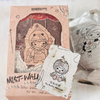 A Pop Mart 'Mist Walker' blind box package shown the product card, text of "The Backlit Messenger".