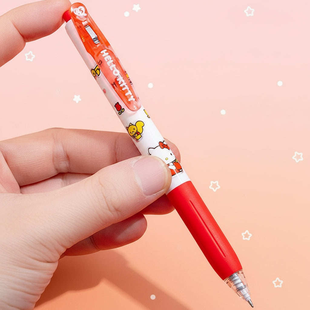 A hand holding a red and white Hello Kitty retractable pen against a solid orange background, with Chinese text callouts.