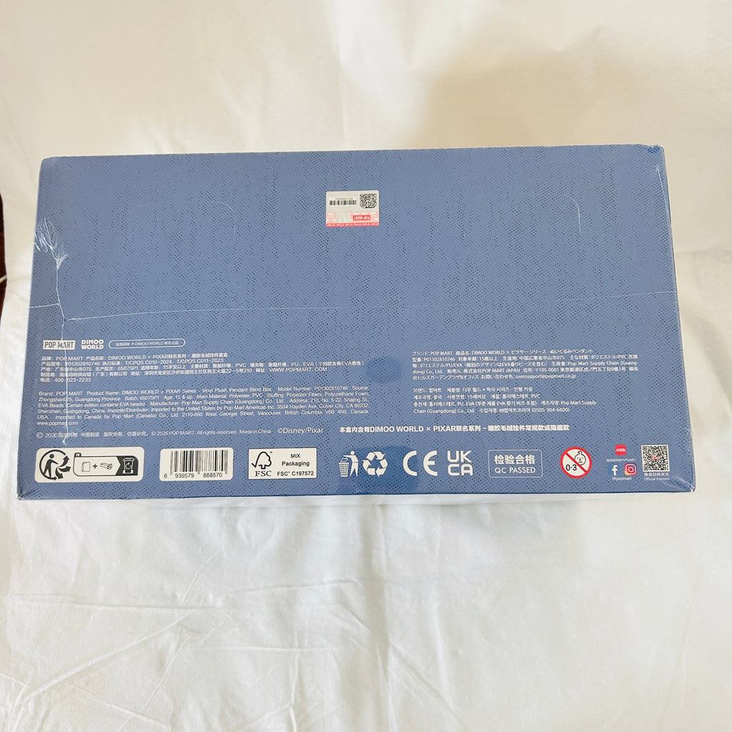 The back of a blue rectangular product box. The box contains small printed text, barcodes, recycling symbols, and compliance marks.