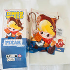 A Disney Pixar Dimoo World collectible figure plush pendant product box. Opened from the bottom and shows a card of Red Panda Mei.