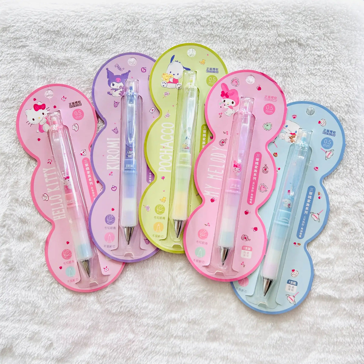 Five Sanrio Hello Kitty and Kuromi mechanical pencils in their original colourful blister packaging.