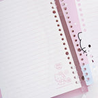 Hello Kitty lined notebook pages with a pink spiral binder and a decorative pink cover featuring Hello Kitty illustrations.