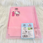 A pink Hello Kitty file folder inside a clear plastic sleeve, displayed on a white faux fur surface. The folder features a Hello Kitty character graphic and a pink apple illustration, with a blue and white product label attached at the bottom right.