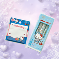 Hello Kitty stationery set featuring a blue notepad and three matching pens in a light blue package, displayed on a soft pastel background with heart and snowflake decorations.