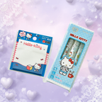 Hello Kitty stationery set featuring a blue notepad and three matching pens in a light blue package, displayed on a soft pastel background with heart and snowflake decorations.