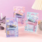 Three packaged Sanrio Characters stapler sets, including a purple Kuromi-themed stapler, a pink My Melody-themed item, and a light blue Cinnamoroll-themed item.