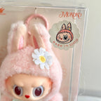 
A clear plastic box, featuring a round character sticker that reads 'MOKOKO' and 'I'M SCENTLY'.
