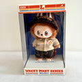 A front view of the side of a Labubu Wacky Mart Series plush doll, which with brown fur and wearing uniform. 

