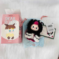 A Pop Mart 'Dear Birds' blind box mystery plush keychain set, showing the pink illustrated retail box, the black-and-white striped fuzzy bird plush. 