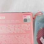 Close-up of the back of a pink Pop Mart box with printed product details and a QR code.