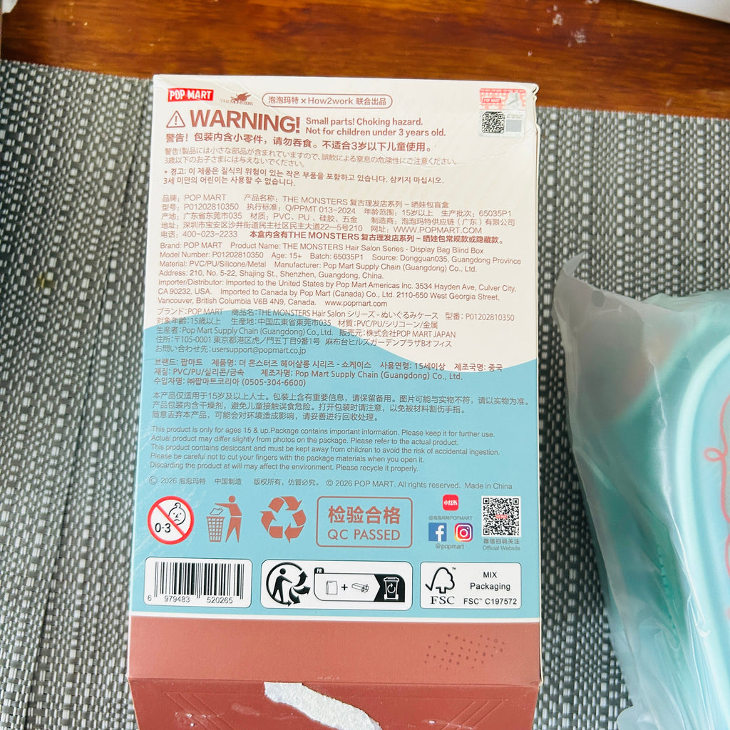 The back view of the package box of Pop Mart, shows the product information and license mark