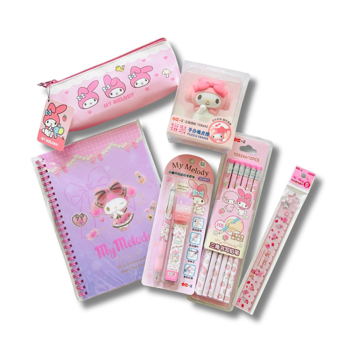 A set of Sanrio My Melody stationery items, including a pink pencil case, a purple spiral notebook, a mechanical pencil, a pack of pencil, a  ruler and a rubber.