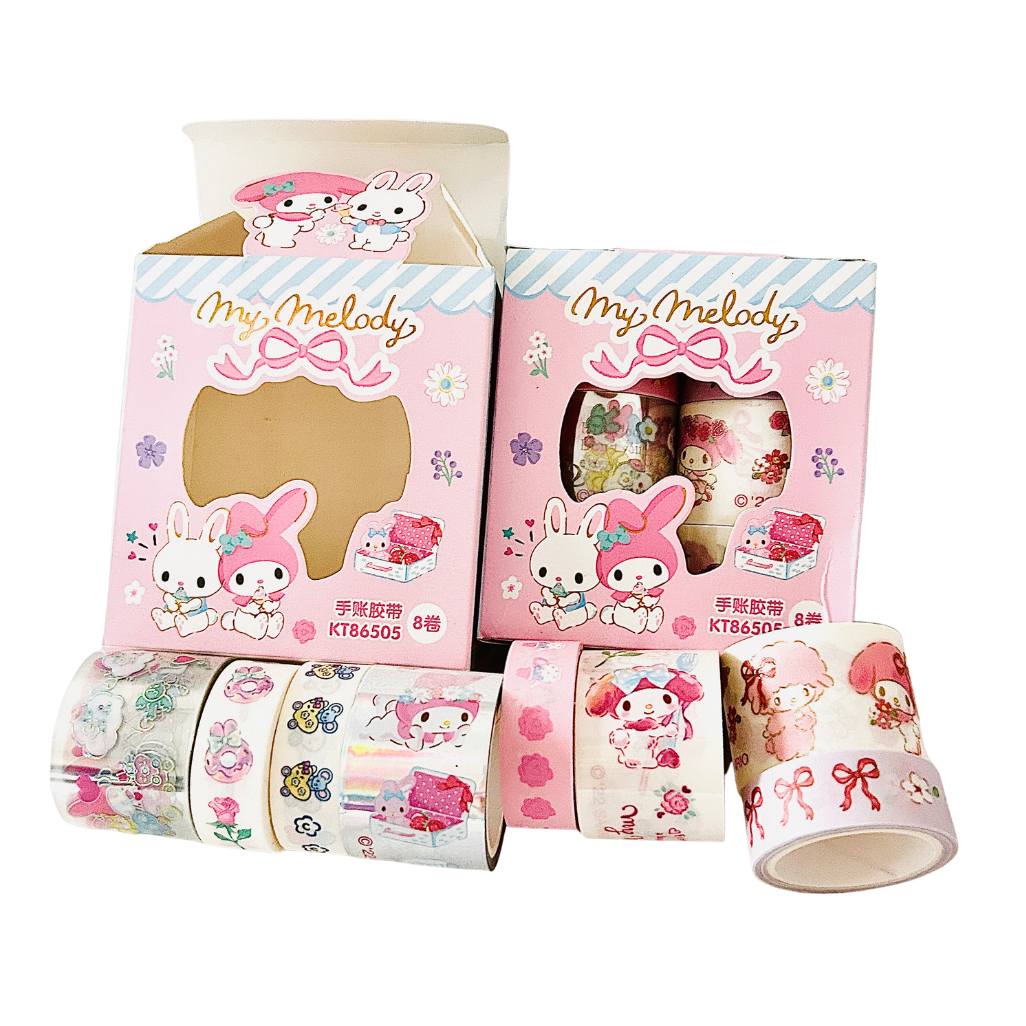Pink My Melody washi tape rolls displayed with their retail packaging on a clean white background. The packaging features cute illustrations of My Melody and Sanrio characters, and the tape itself has various pastel patterns.