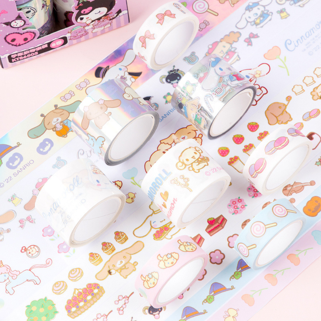 A set of pastel washi tapes with cute cartoon characters and food illustrations, arranged on a pink background with a matching roll of tape partially unrolled.