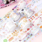 A set of pastel decorative washi tapes with Sanrio character illustrations. The rolls feature soft pastel colors and characters like Cinnamoroll.