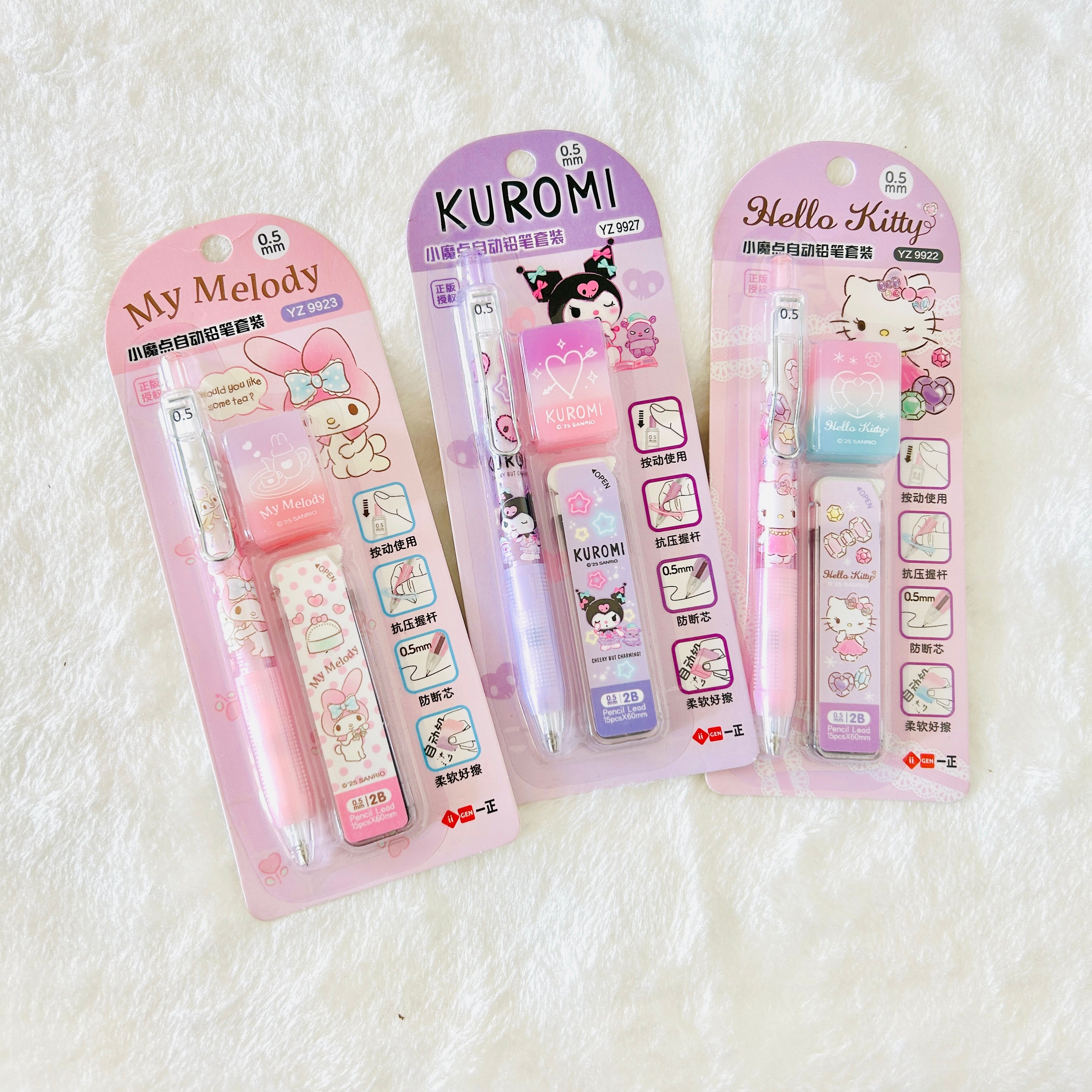 Three Sanrio character pen sets in pink and purple packaging, featuring My Melody, Kuromi, and Hello Kitty designs.