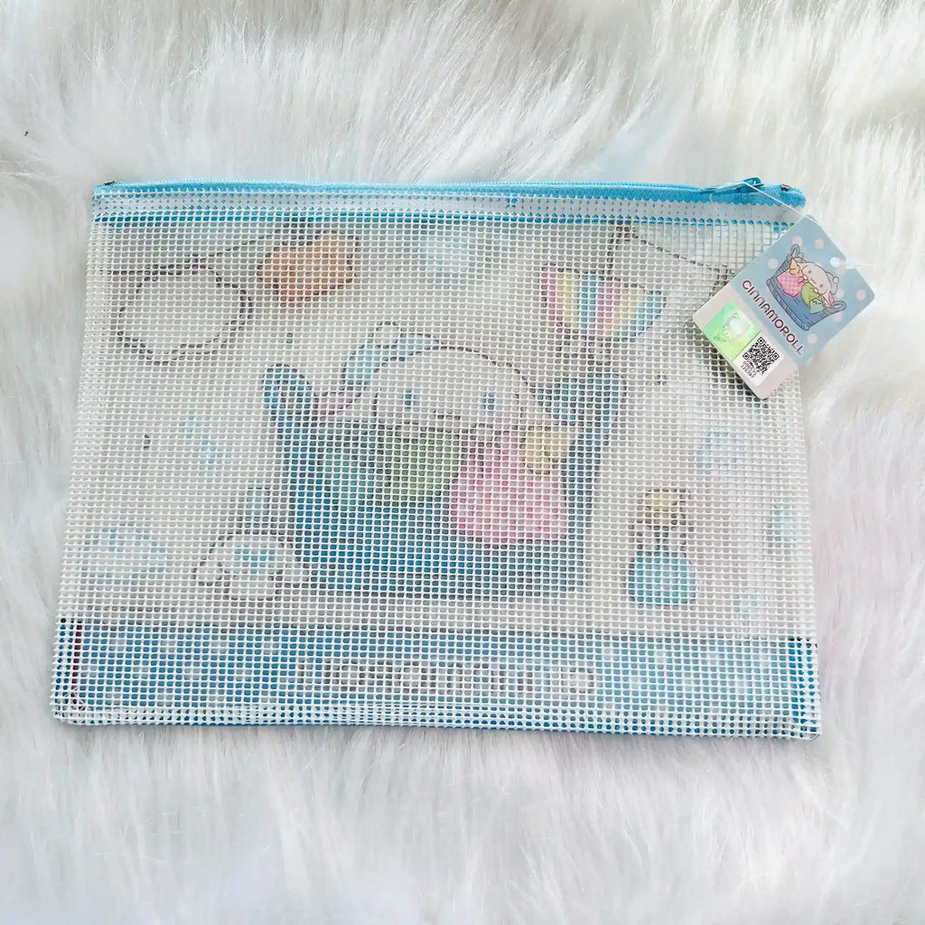 A Sanrio Cinnamoroll mesh zipper pouch in light blue and white, featuring a printed design of Cinnamoroll and a hanging product tag.