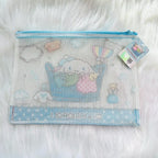 A Sanrio Cinnamoroll mesh zipper pouch in light blue and white, featuring a printed design of Cinnamoroll and a hanging product tag.