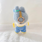 Back view of a Labubu plush wearing a cream and blue striped outfit.