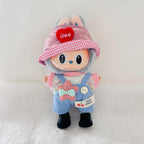A Labubu plush doll wearing a pink-and-white gingham bucket hat with a red heart patch that says 'love', a pink knit top, blue striped overalls, and black boots.  