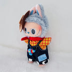 A Labubu plush doll dressed in a cowboy-inspired outfit, featuring a brown hat, a red-and-yellow plaid shirt, a red scarf, and dark denim overalls.