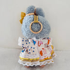 Back view of a Labubu plush doll wearing a white lace dress with stars pattern.