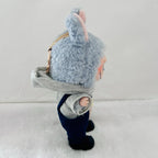 A Labubu doll with a grey hood, navy overalls, and black shoes, standing against a plain light background.