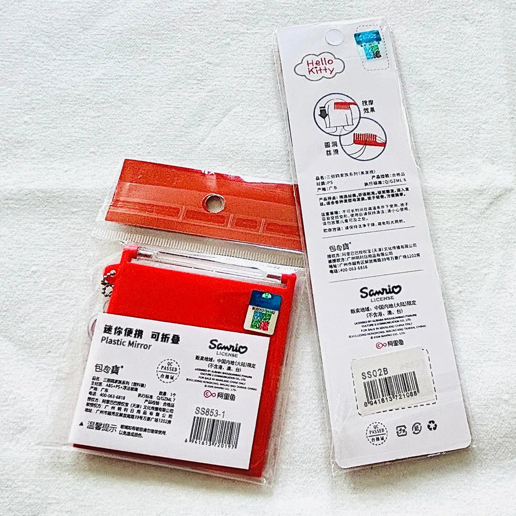A pack of red plastic mirrors with white product labels and an instruction card, displayed on a textured white fabric background.