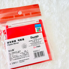 A red plastic folding mirror in its original packaging, featuring Chinese and English text, a barcode, the Sanrio brand logo on the white label, and a holographic sticker. 